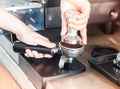 Barista with tamper for making espresso with vintage style Royalty Free Stock Photo