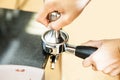 Barista tamping coffee in a portafilter Royalty Free Stock Photo