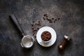 Barista tools and coffee cup with beans on dark textured stone background, top view with copy space Royalty Free Stock Photo