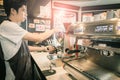 Barista use grider make a coffee with vintage tone. Royalty Free Stock Photo