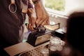 the barista who flattens fine coffee onto the press