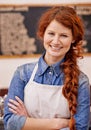 Barista, woman and arms crossed in portrait at coffee shop with smile, pride and entrepreneurship. Person, waitress or Royalty Free Stock Photo