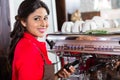 Barista woman making coffee in cafe with machine