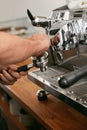 Barista Working On Coffee Machine In Cafe Closeup