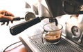 Barista makeing coffee with coffee machine in cafe Royalty Free Stock Photo