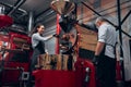 Baristas creating coffe in the modern coffe machine. Low angle Royalty Free Stock Photo