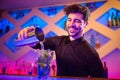 Barkeeper pouring cocktail in glass Royalty Free Stock Photo