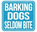 BARKING DOGS SELDOM BITE, words on blue stamp sign