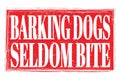 BARKING DOGS SELDOM BITE, words on red grungy stamp sign