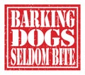 BARKING DOGS SELDOM BITE, text written on red stamp sign