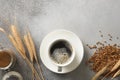 Barley coffee in white cup and ears of barley on gray background. Royalty Free Stock Photo