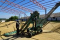 Barley crops being separated out of dust in the yard. Royalty Free Stock Photo