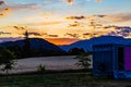 Barley field with a backdrop of the Southern Alps at sunset in Wanaka Otago New Zealand Royalty Free Stock Photo