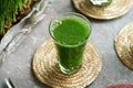 Barley grass juice in a glass cup Royalty Free Stock Photo