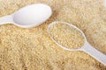 Barley groats on wooden spoon. Barley groats background. Top view Royalty Free Stock Photo