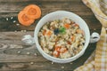 Barley porridge with carrots, onions in white bowl Royalty Free Stock Photo