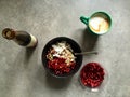 Barley porridge with coconut, pistachios, pomegranate seeds, pomegranate molasses