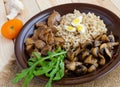 Barley porridge, fried mushrooms and duck liver, boiled quail eggs, tomatoes, arugula - healthy food Royalty Free Stock Photo