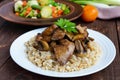 Barley porridge, fried mushrooms and duck liver, boiled quail eggs, tomatoes, arugula - healthy food Royalty Free Stock Photo