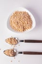 Barley rice in ceramic cup and spoon on white background Royalty Free Stock Photo