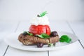 Barley rusk dakos, topped with feta cheese, tomato cubes, olive oil and oregano, Greek appetizer