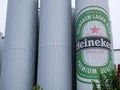 Barley tanks with Heineken logo at local beer factory.