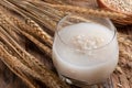 Barley water in glass with raw and cooked