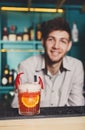 Barman amd creative spicy cocktail in night club bar background Royalty Free Stock Photo