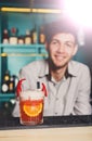 Barman amd creative spicy cocktail in night club bar background Royalty Free Stock Photo