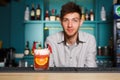 Barman amd creative spicy cocktail in night club bar background Royalty Free Stock Photo