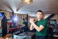 Barman barista throws glass for a cocktail at the bar