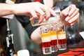 Barman or bartender preparing alcohol cocktail in restaurant