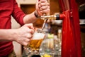 Barman brewing a draft, unfiltered beer at pub Royalty Free Stock Photo