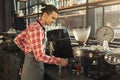 Barman brewing espresso in professional coffee machine Royalty Free Stock Photo