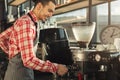 Barman brewing espresso in professional coffee machine Royalty Free Stock Photo