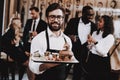 Barman. Burger on Plate. Fun. Together in Bar. Royalty Free Stock Photo