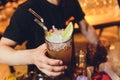 Barman is decorating cocktail with rocket no face. Royalty Free Stock Photo