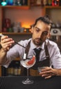 Barman decorating goblet glass