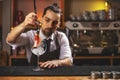 Barman decorating goblet glass