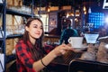 The barman girl works at bar in restaurant