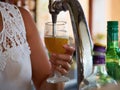 Barman hands pouring draught beerfrom a tap Royalty Free Stock Photo