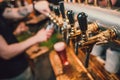 Barman hands pouring a lager beer in a glass. Royalty Free Stock Photo