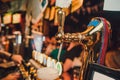 Barman hands pouring a lager beer in a glass. Royalty Free Stock Photo