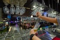 Barman hands pouring a lager beer in a glass Royalty Free Stock Photo