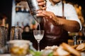 Barman i mixes a white cocktail using bar equipment Royalty Free Stock Photo