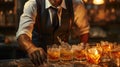 Barman making a cocktail at the bar counter in a nightclub