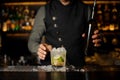 Barman making final preparing before serving a cocktail Royalty Free Stock Photo