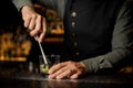 Barman mixing a cane sugar with lime in the glass Royalty Free Stock Photo