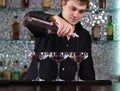 Barman mixing cocktails at the bar Royalty Free Stock Photo