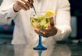 Barman mixing mojito cocktail on a balloon cup. Concept for alcoholic drinks and cocktails Royalty Free Stock Photo